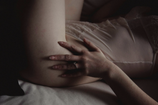 Woman in Portland understanding arousal wearing a white gown.